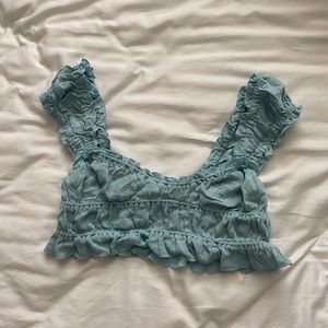 Cute summer crop top, light blue, size small, with stitching details.